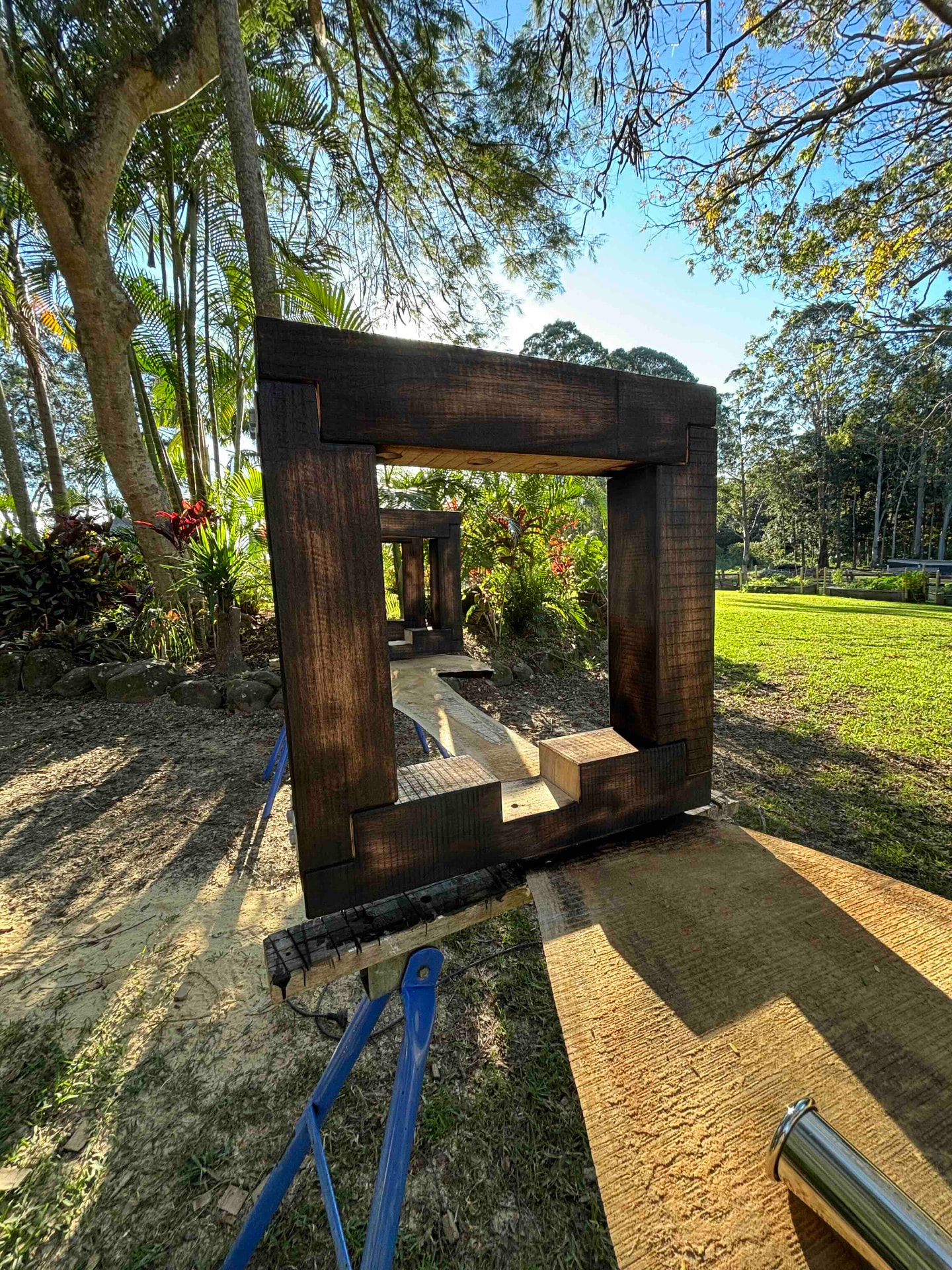 Hand-cut housing joint in the dark stained recycled hardwood table frame